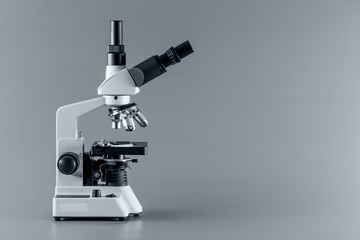 Trinocular  microscope on blue background
