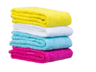 Obraz na płótnie Canvas Fresh towels stack complete 3/4 view isolated on white background