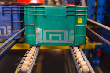Conveyor rollers transport system for crates in factory