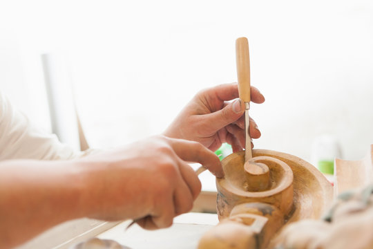 working hands of craftsman restorer