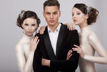 Two Young Women and Trendy Man