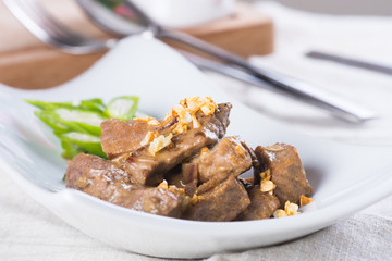 beef salpicao, or beef with creamy soy sauce topped with toasted garlic