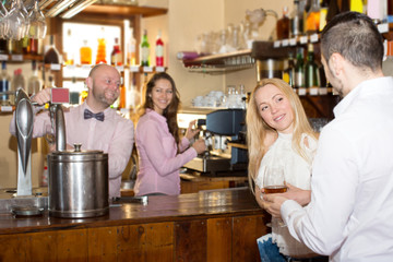Fototapeta na wymiar Restaurant visitors drinking wine