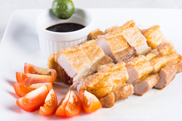 crispy pork belly with soy sauce and calamansi to dip
