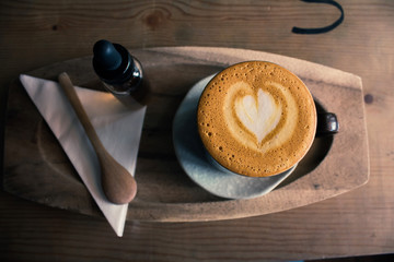 cup of coffee top view surface heart shape in wooden background