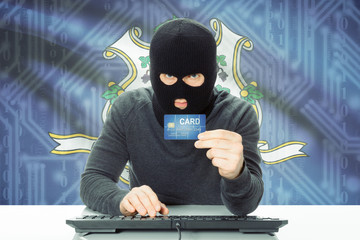 Hacker holding credit card and USA state flag on background - Connecticut