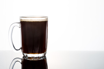 Aromatic hot black coffee in a transparent glass