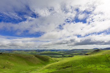 Fototapeta premium Clouds over the green valley