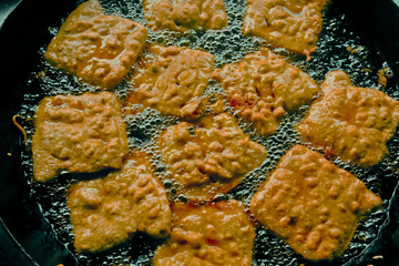 Bread patties in oil