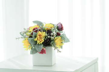 Artificial roses in the basket in vintage color