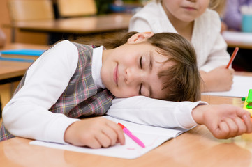 Obraz na płótnie Canvas girl sleeping in classroom