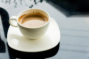 coffee cup on black table