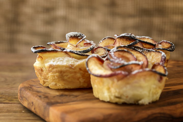 apple shaped rose dessert on wooden table