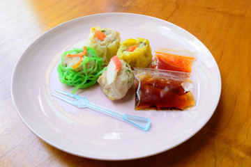 Delicious dim sims on dish