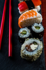 Sushi selection with chopsticks from above