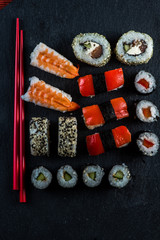 Sushi selection with chopsticks from above