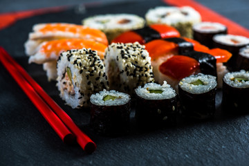 Sushi selection with chopsticks from above