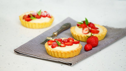 tartlets with custard and berries