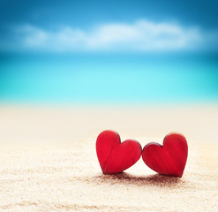 Two heatts on the  summer beach