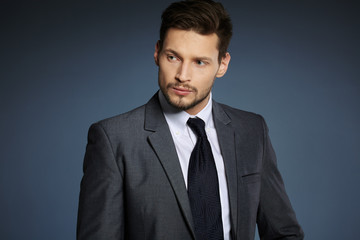 business, people and office concept - businessman in suit