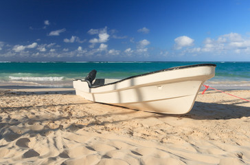Motor boats on the sand near the ocean colorful