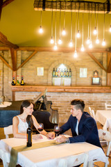 Young couple drinking red wine