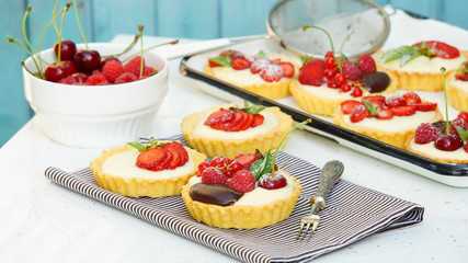 tartlets with custard and berries