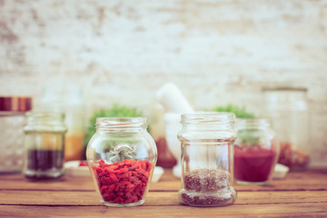 Goji and chia seeds (superfood) on wooden tabe