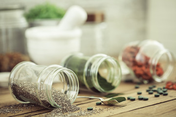 Goji, spirulina and  chia seeds (superfood) on wooden tabe