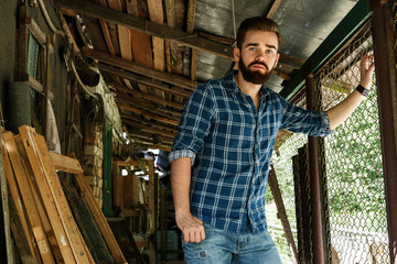 Bearded man in checkered shirt
