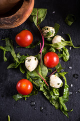 Fresh tomato and mozzarella salad on black slate