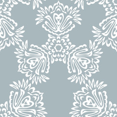 Seamless background made of exotic pattern in grey and white col
