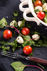 Fresh tomato and mozzarella salad on black slate