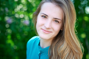 Fototapeta premium beautiful spring young woman in a park