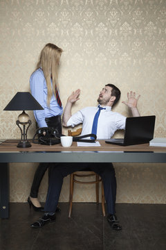 business woman intimidates employee