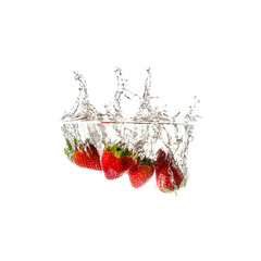 Strawberries splash on water, isolated on white background