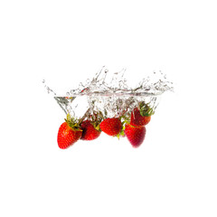 Strawberries splash on water, isolated on white background