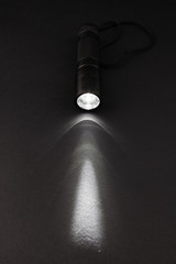 LED flashlight with a light beam