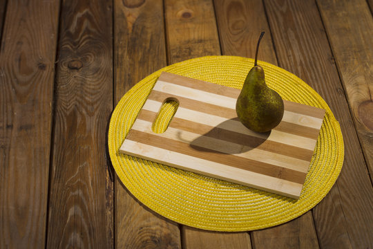 Pear on a chopping board.