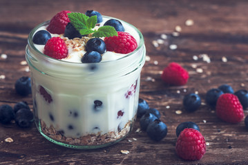 Yogurt with Fresh Berries on Woden Table