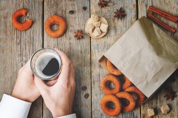 man holding glass of coffee