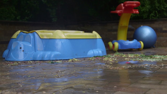 Kids outdoor toys on the patio in the rain