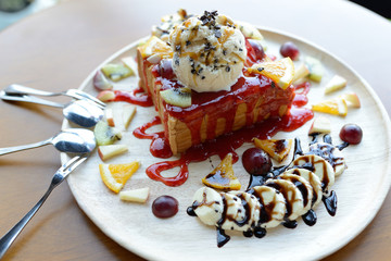 Strawberry honey toast with whipped cream,ice cream and mix berr