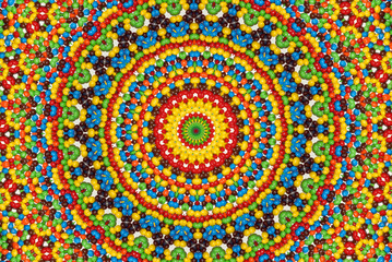 A colorful red, green, yellow, blue, white, orange and black kaleidoscope.