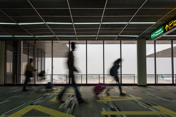 moving blur motion of people walking in airport walkway
