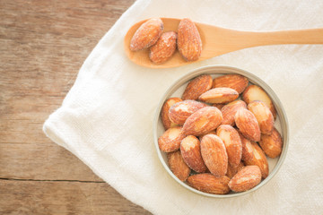 Almond grain roast salt on weathered wooden table