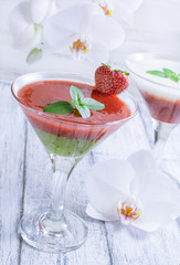 Fresh fruit and berry cocktail  on shabby wooden boards