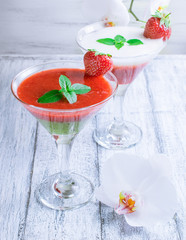 Fresh fruit and berry cocktail  on shabby wooden boards and whit