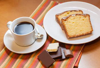 Two pieces of cake, chocolate  and cup of coffee