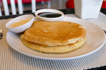 pancake serving with chocolate sauce and butter